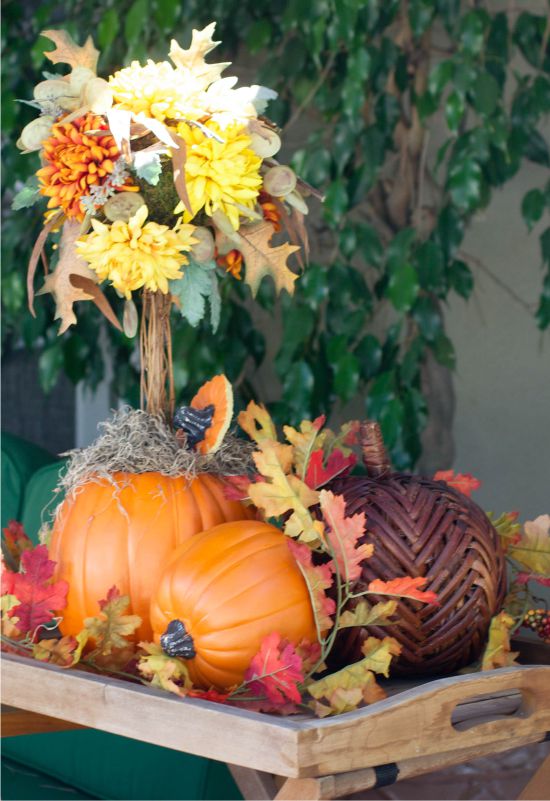 Topiary of pumpkin, autumn leaves and flowers